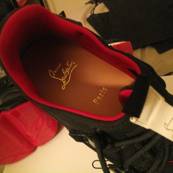 A pair of red bottom sneakers - Picture 3 of 5